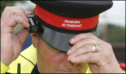 Civil Enforcement Officer using a camera